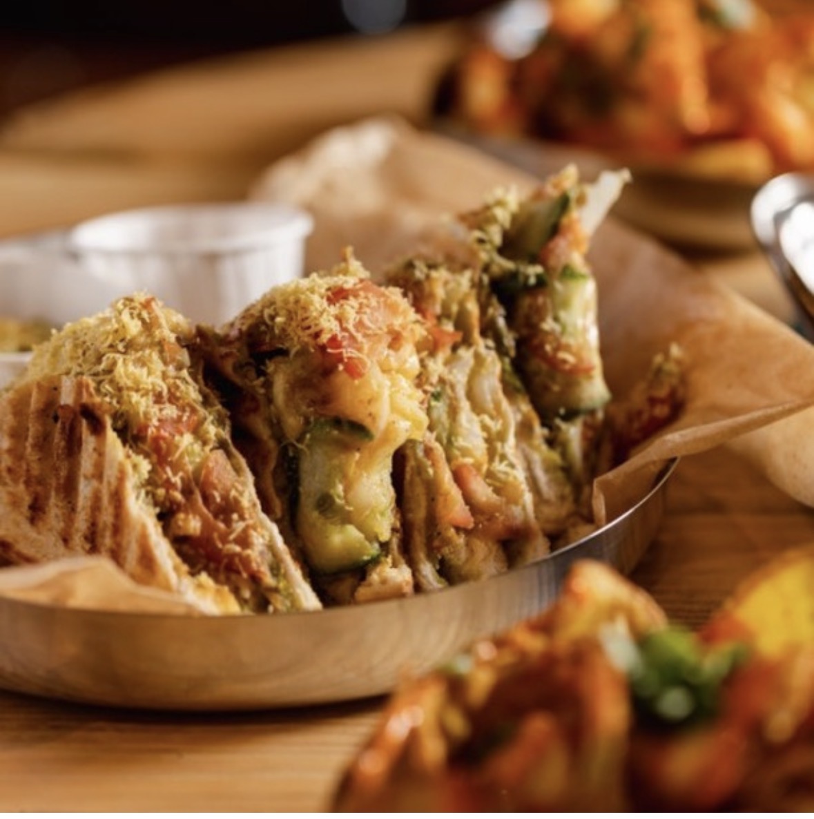 Toasted Mumbai Mix sandwiches, filled with vegetables and topped with sev and chutney